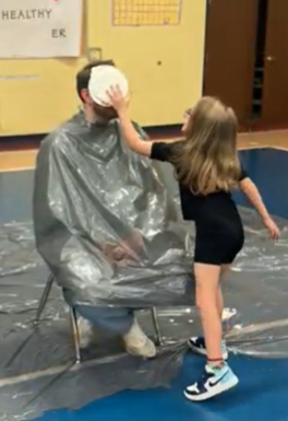 Students get to Pie Mr. Harbour in the face