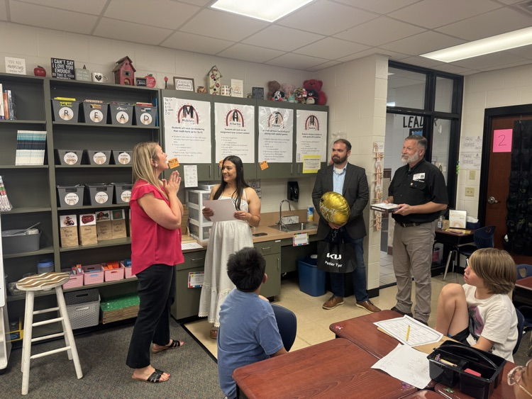mrs. Harville being presented with her award