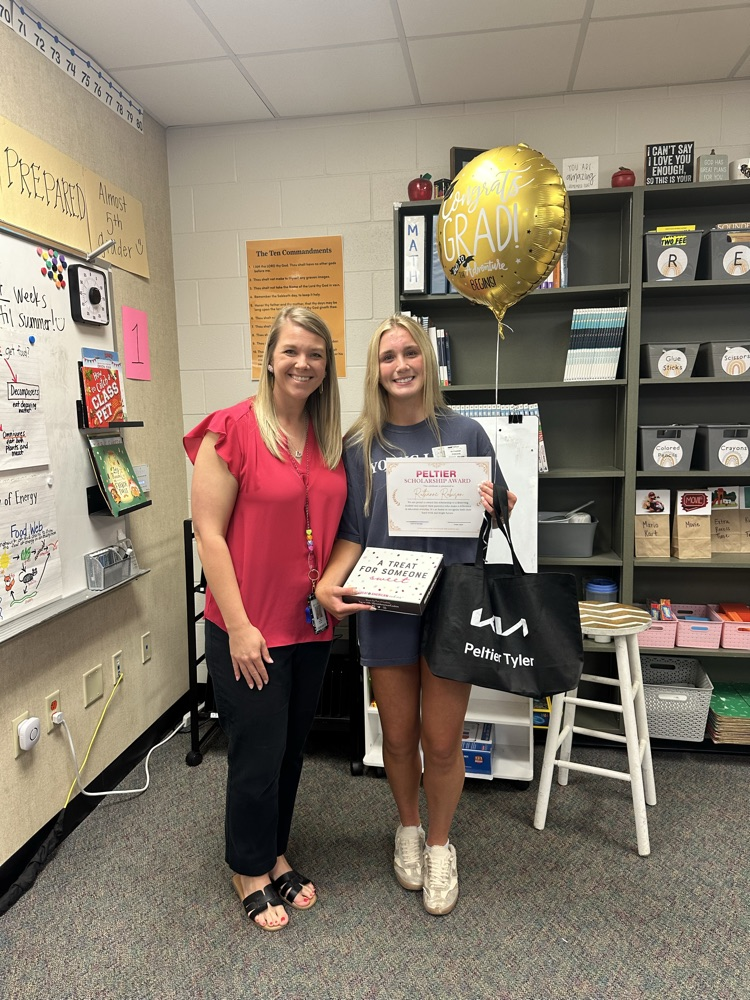 mrs. Harville being presented with her award