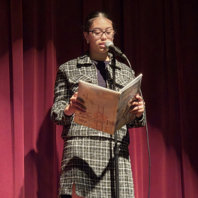 student speaking into microphone