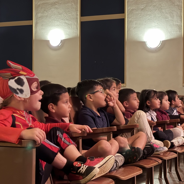 students watching play