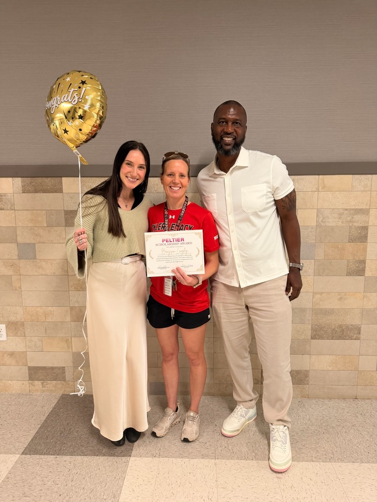 Mrs. Langley with Peltier and the awarded scholarship