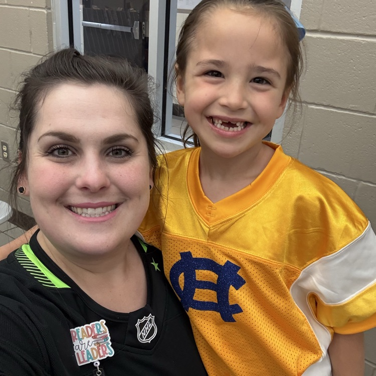 Student and teacher are wearing jerseys