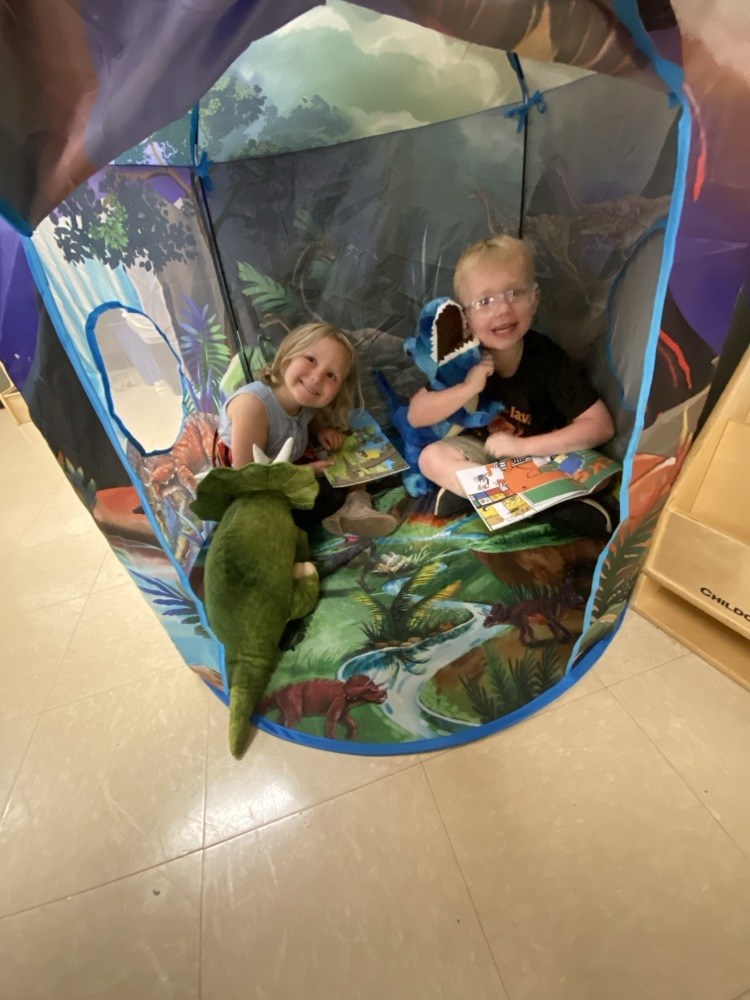 Kids doing dinosaur activities  