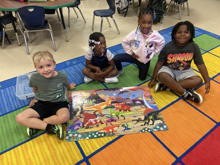 Kids doing dinosaur activities. 
