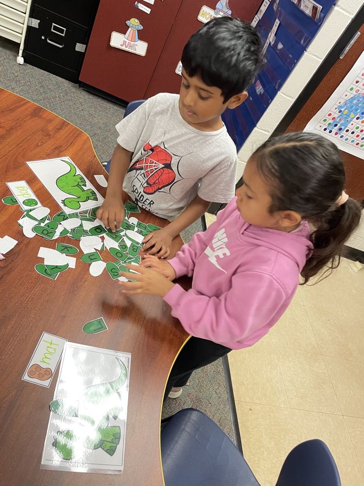 Kids doing dinosaur activities. 