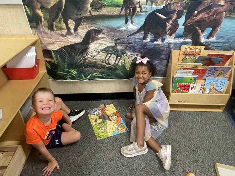 Kids doing dinosaur activities. 