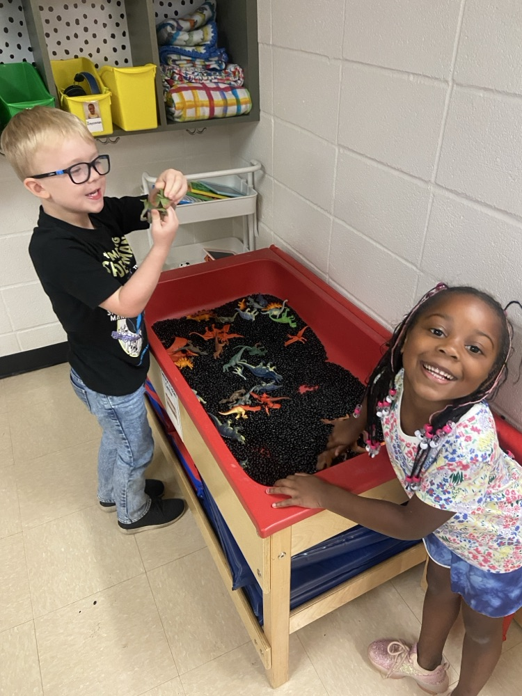 Kids doing dinosaur activities. 