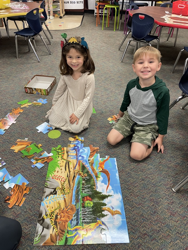 Kids doing dinosaur activities. 