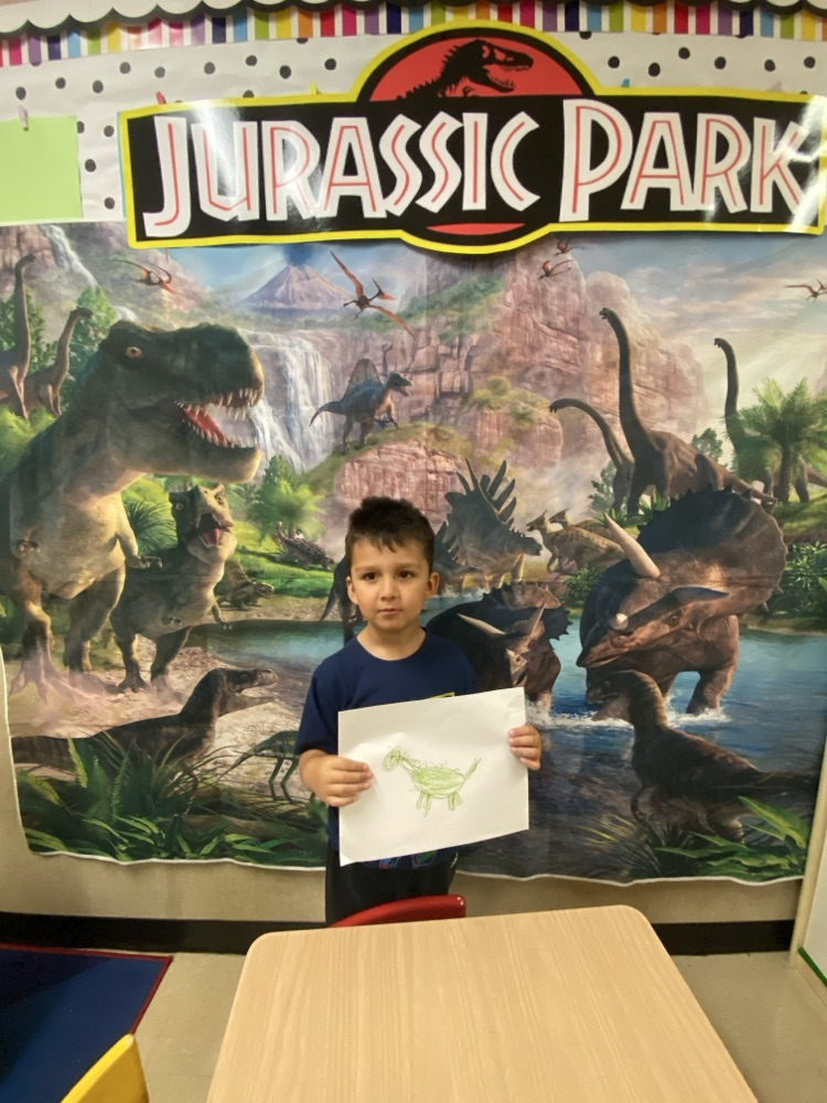 Kids doing dinosaur activities. 