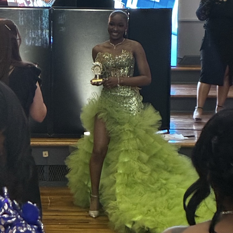 student with trophy