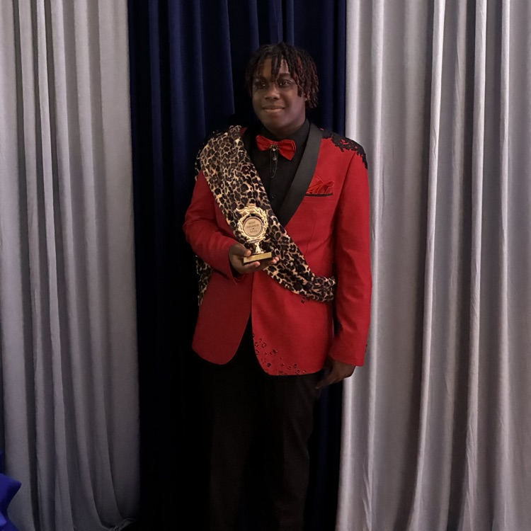 student with trophy 