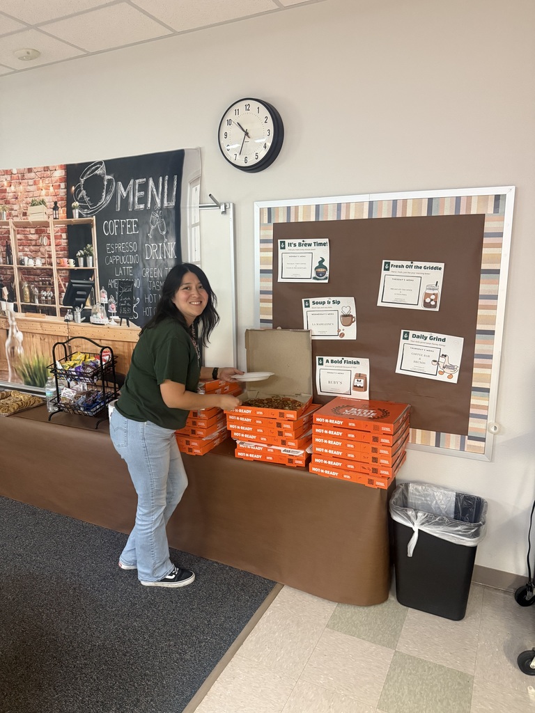 Teacher serving pizza to herself.