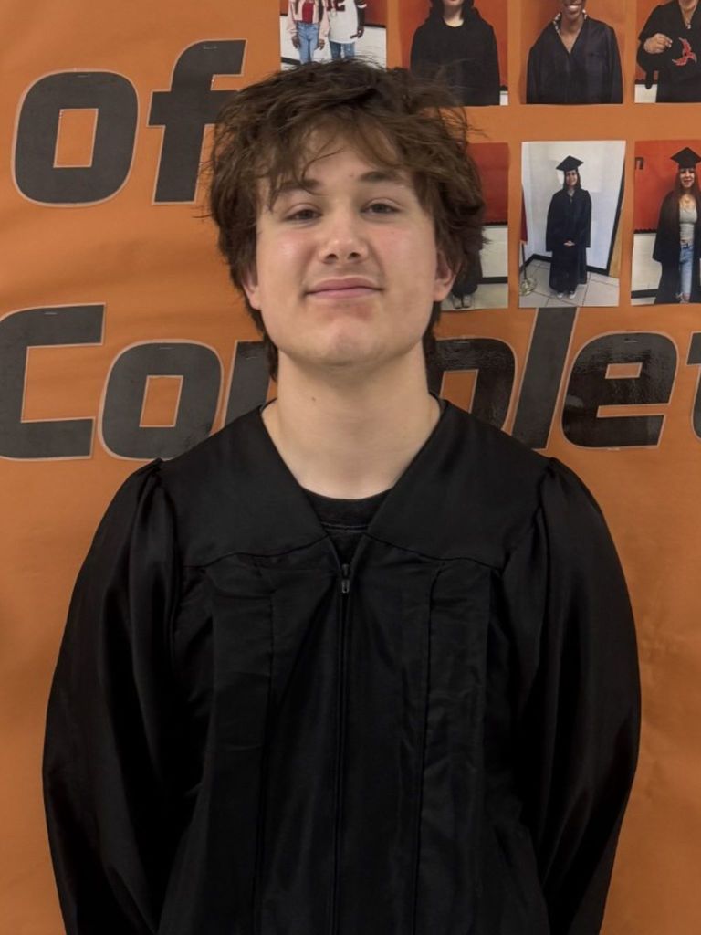 Student posing in graduation regalia