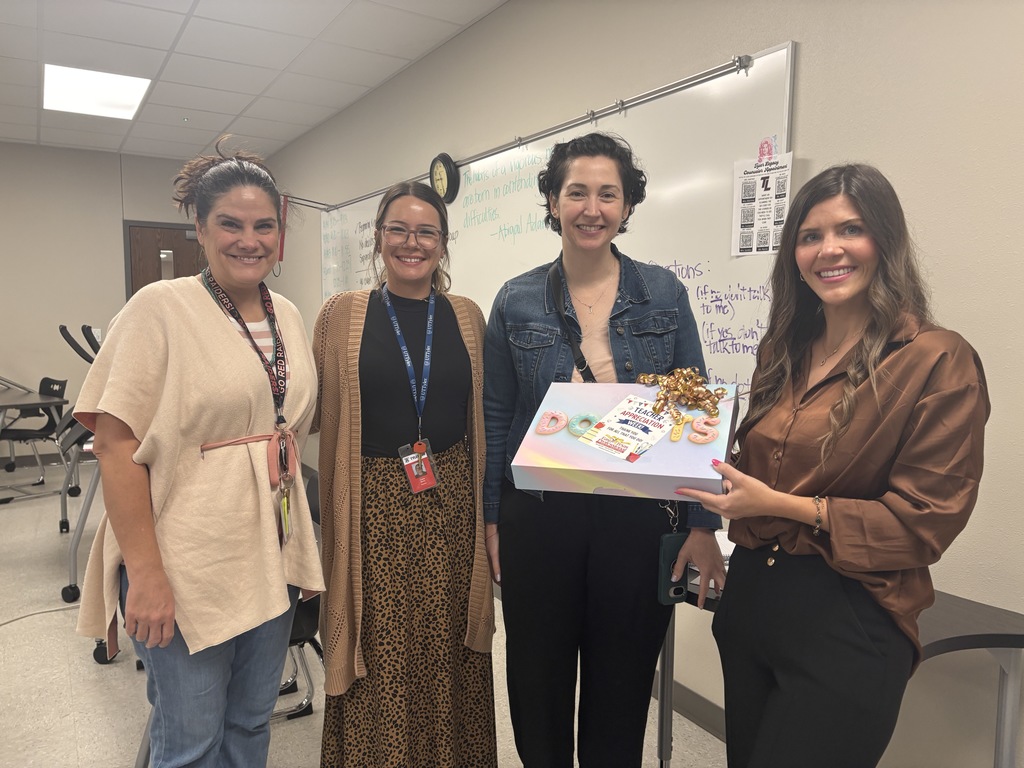 East Texas Credit Union with some of our teachers with a box of donuts