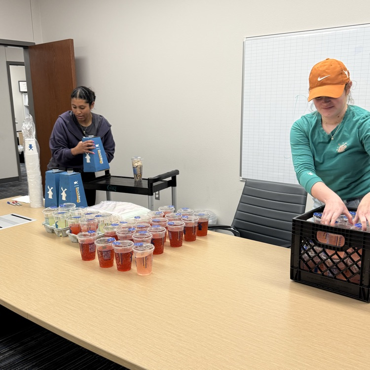 ladies setting up drinks