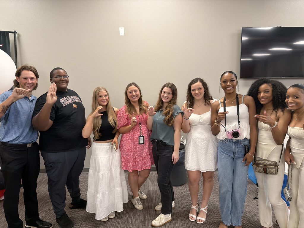 Tyler Legacy AVID senior with their teacher at teacher appreciation breakfast