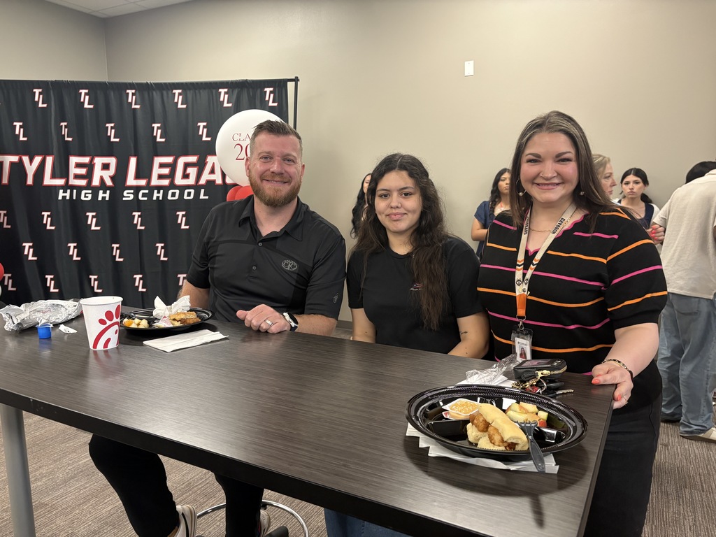Tyler Legacy AVID senior with their teacher at teacher appreciation breakfast