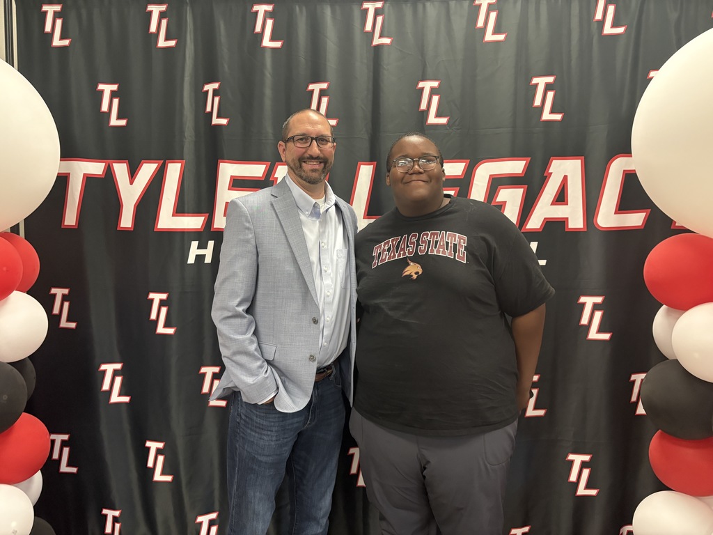 Tyler Legacy AVID senior with their teacher at teacher appreciation breakfast