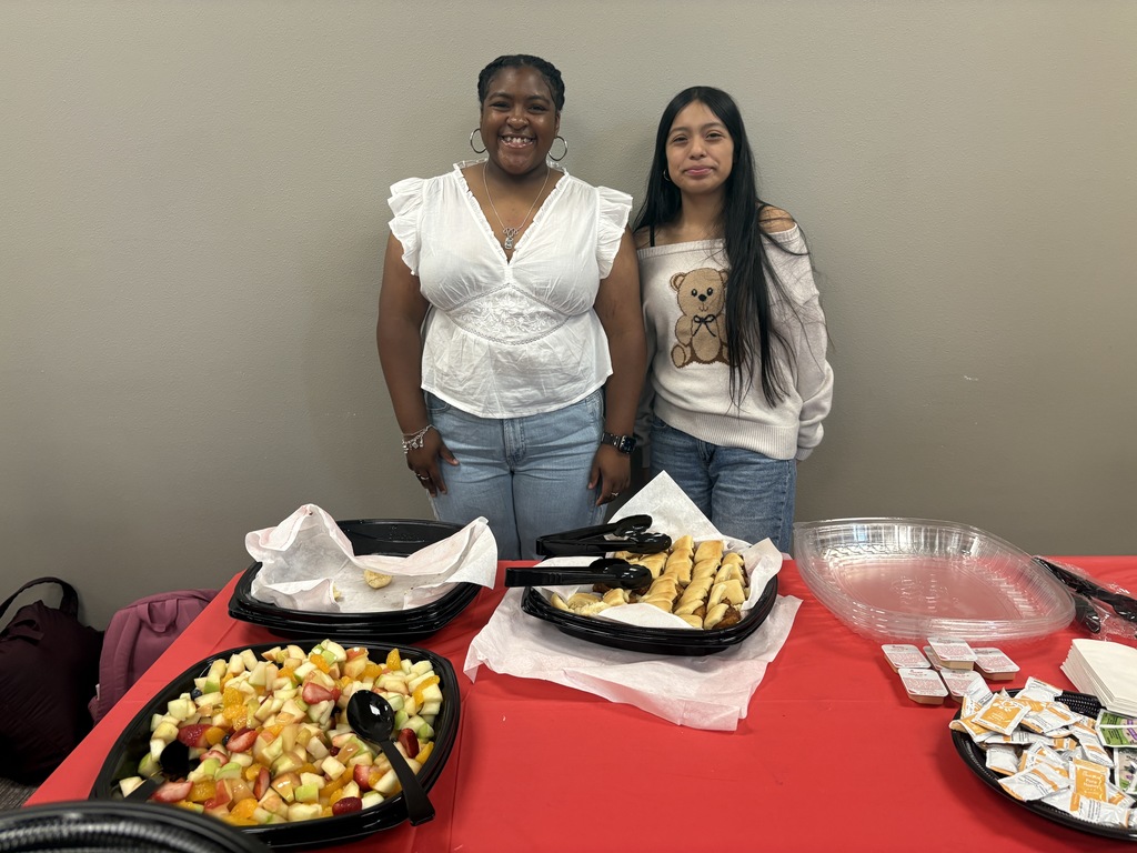 Tyler Legacy AVID senior with their teacher at teacher appreciation breakfast