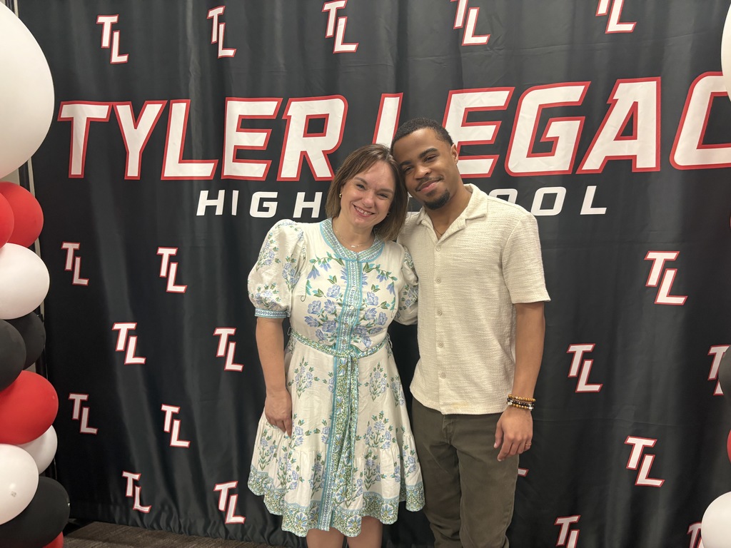 Tyler Legacy AVID senior with their teacher at teacher appreciation breakfast