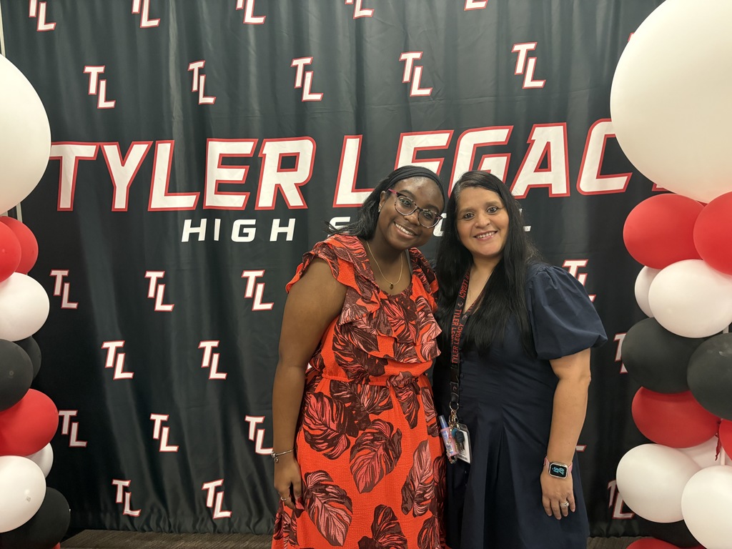 Tyler Legacy AVID senior with their teacher at teacher appreciation breakfast