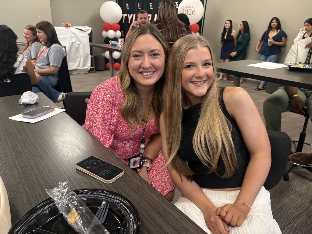 Tyler Legacy AVID senior with their teacher at teacher appreciation breakfast