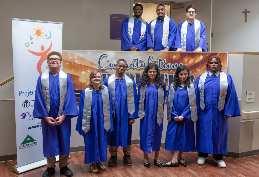 Group of Project Search students smiling during graduation.