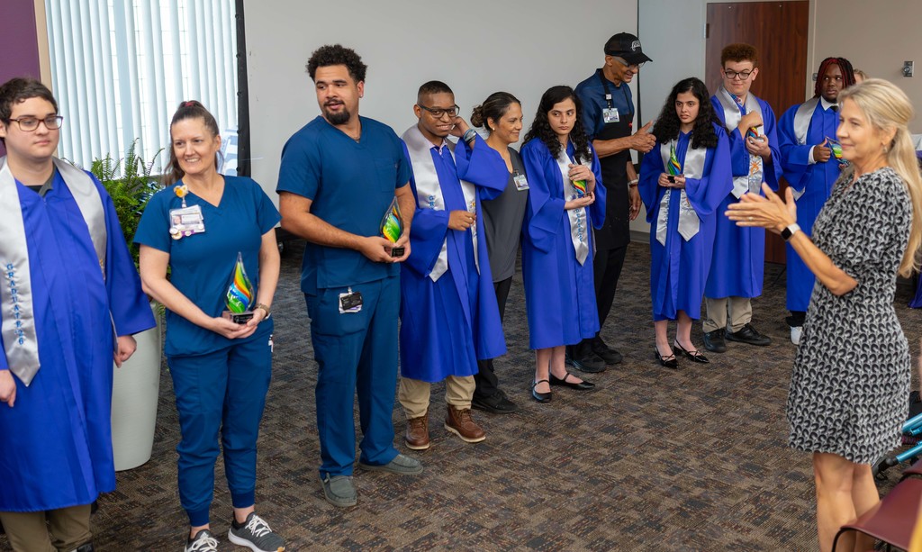 Project SEARCH graduates line up with CHRISTUS employees.
