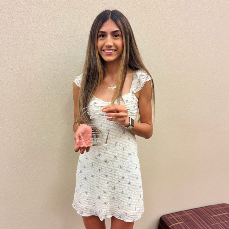 student with trophy