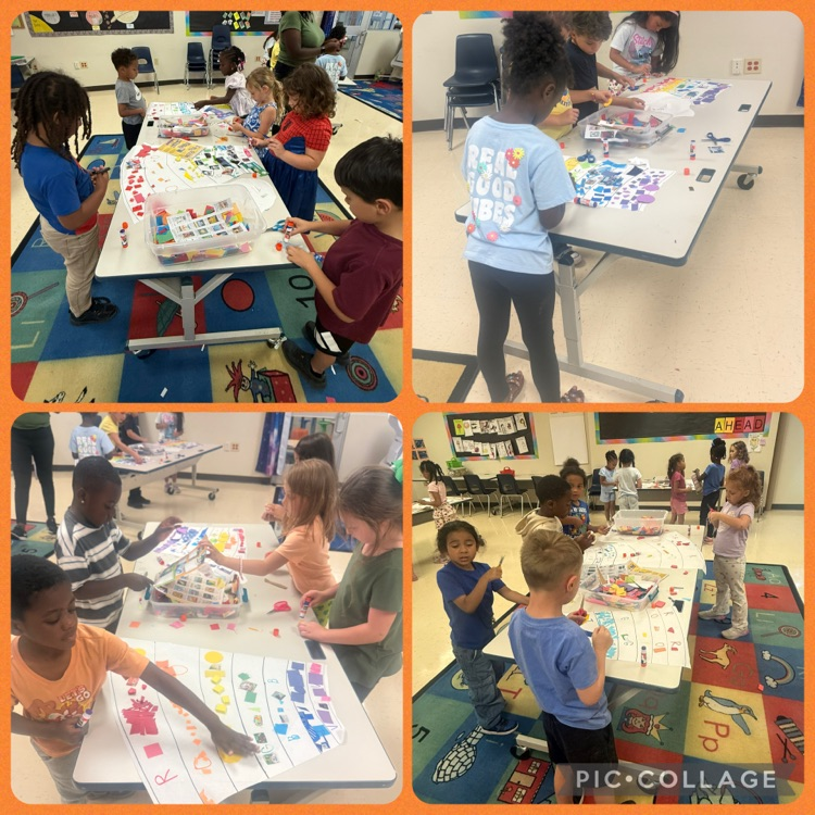 students working on a rainbow mural scrap paper project