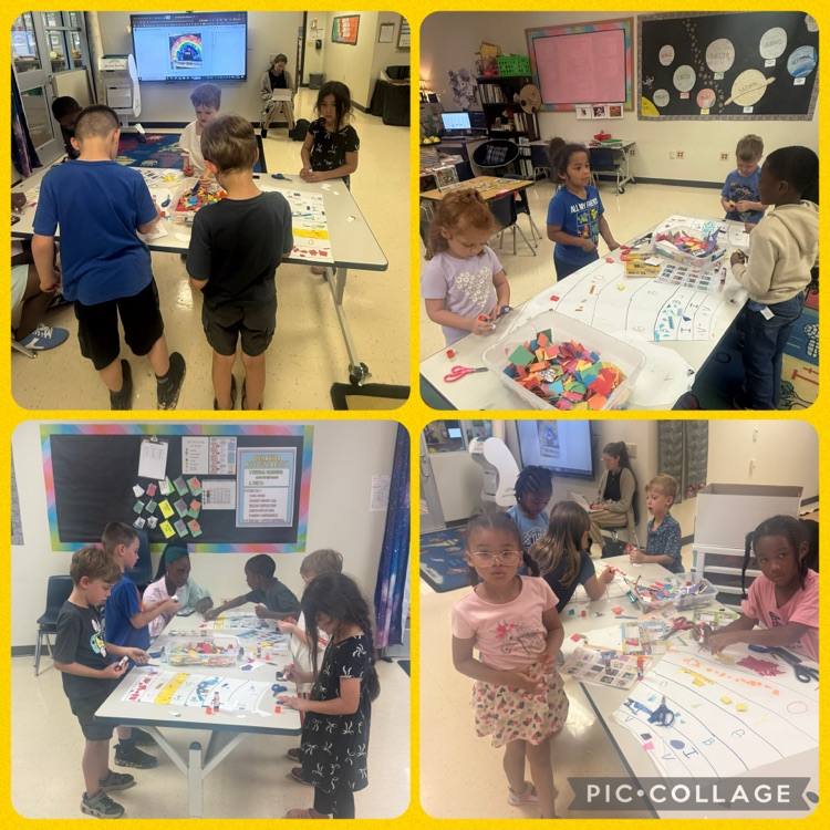 students working on a rainbow mural scrap paper project