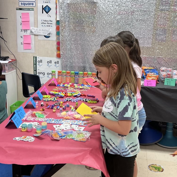 Students shopping with paper money