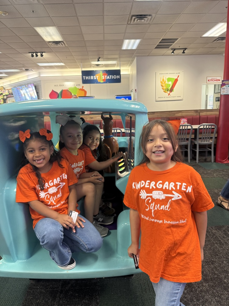 kinder at Chuck E Cheese playing games