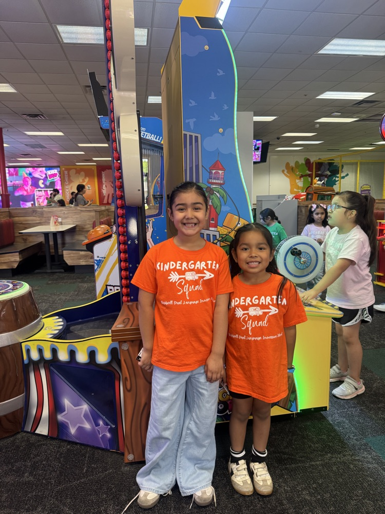 kinder at Chuck E Cheese playing games