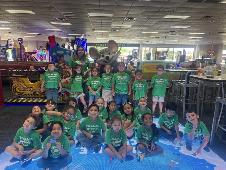 kinder at Chuck E Cheese playing games