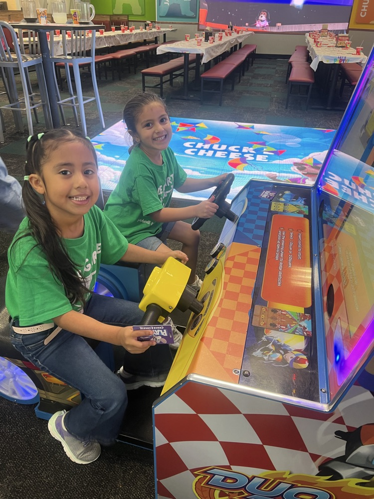 kinder at Chuck E Cheese playing games