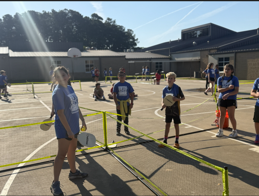 Students playing pickleball.