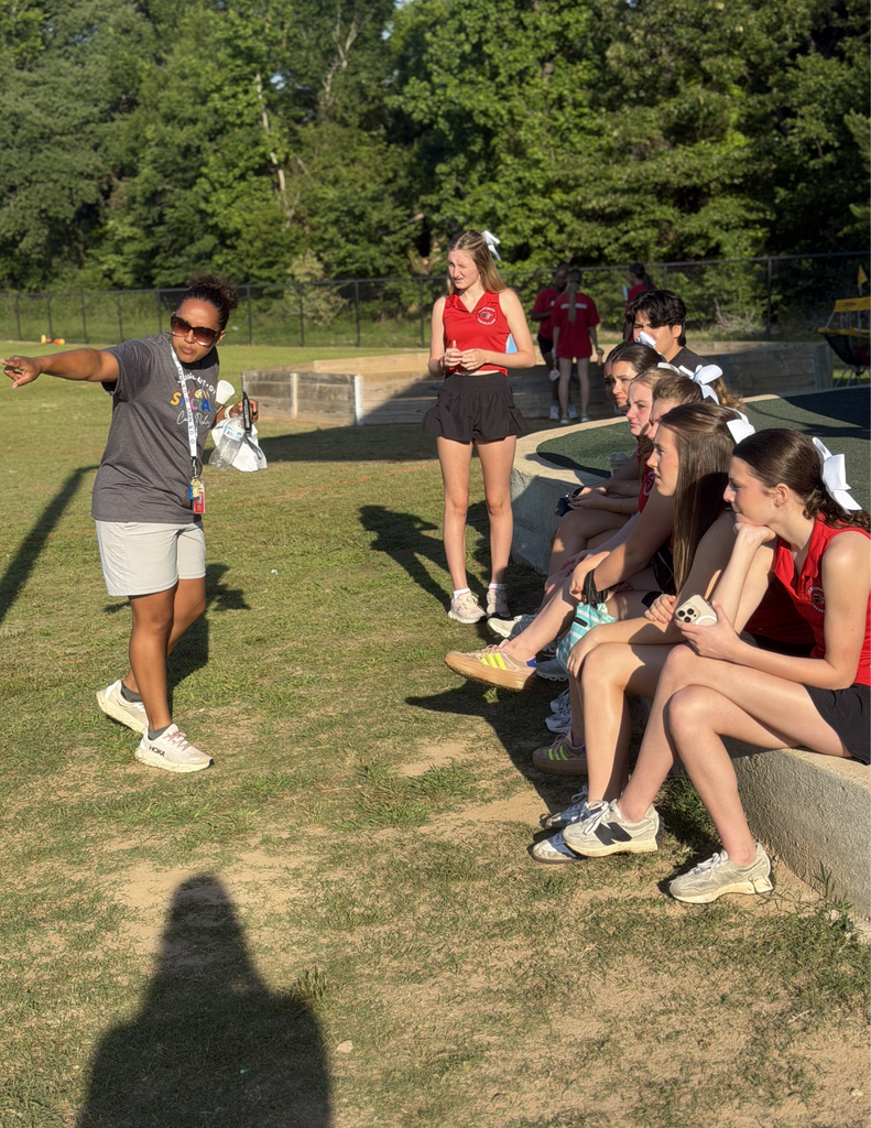 Coach giving directions to students.