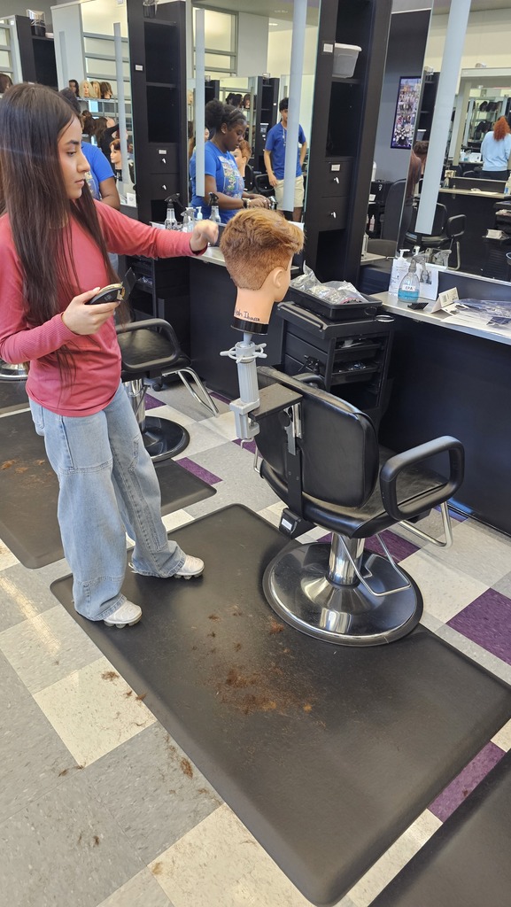 Tyler ISD Career & Technology Center cosmetology student practicing cutting hair.