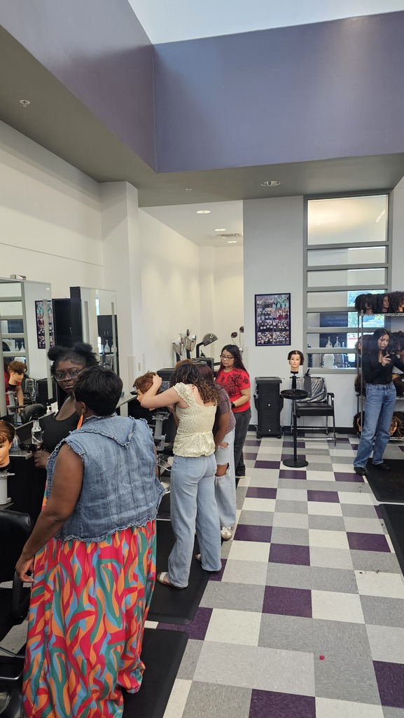Tyler ISD Career & Technology Center cosmetology student practicing cutting hair.