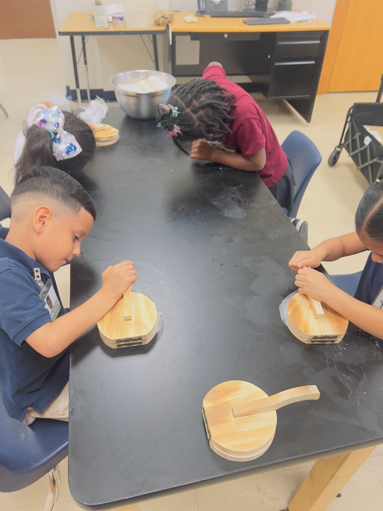 kids making tortillas