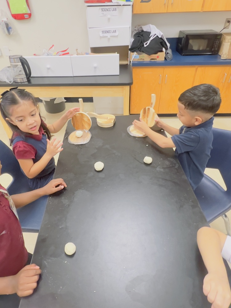kids making tortillas