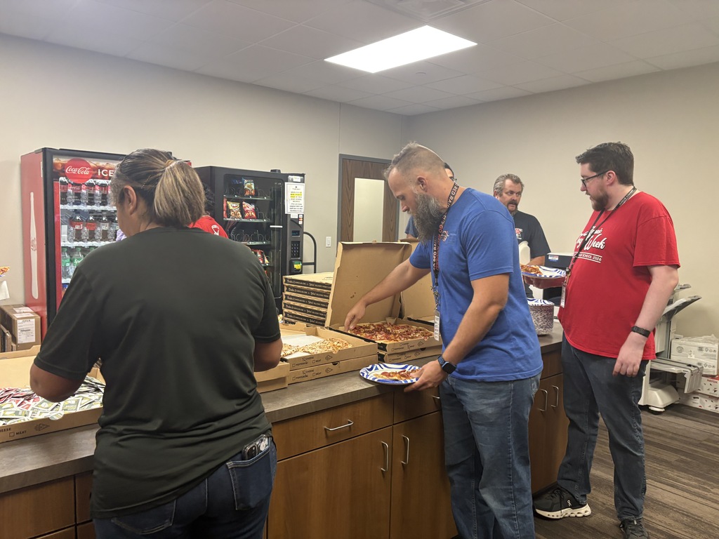 Tyler Legacy PTA in the mailroom with pizza for staff