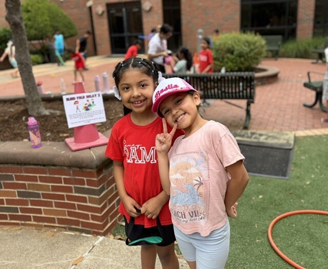two girls smiling
