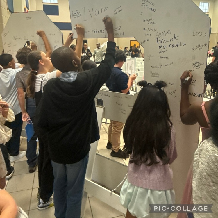 students signing their names on the back of C E S letters