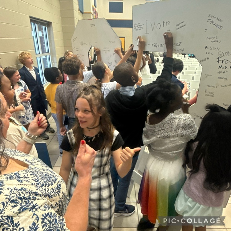 students signing their names on the back of C E S letters