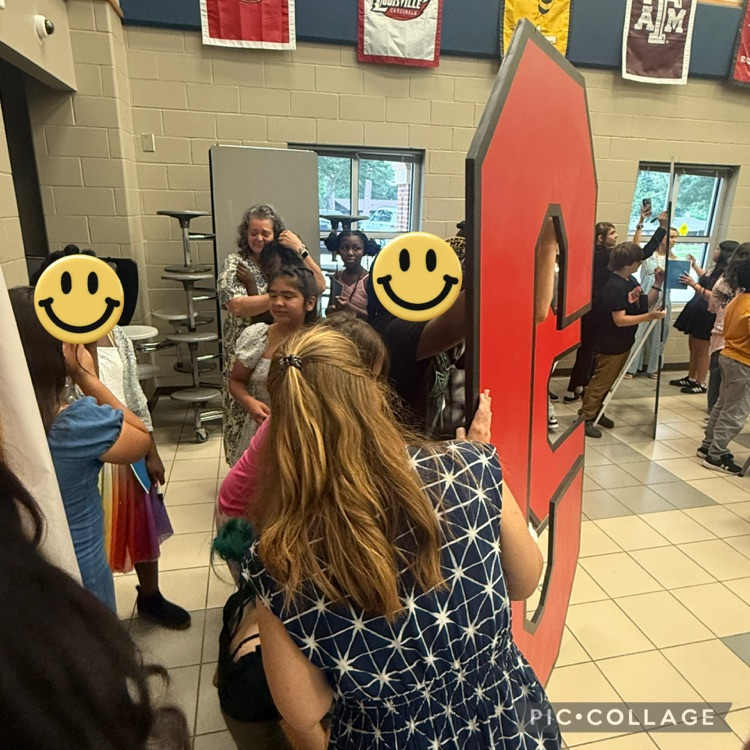 students signing their names on the back of C E S letters