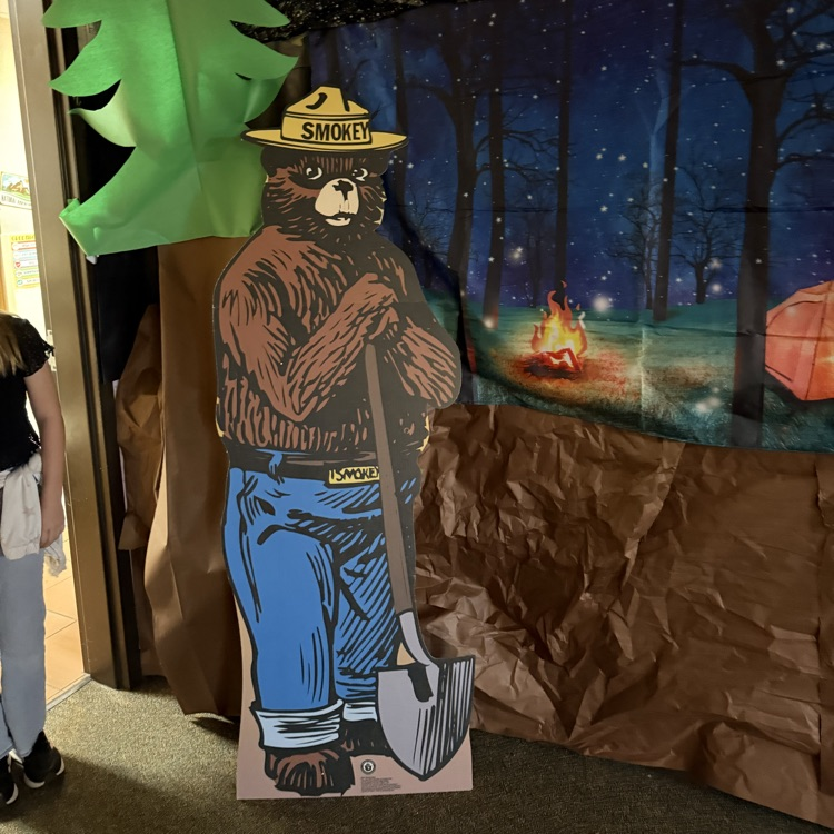 smoky the Bear cut out and camping background