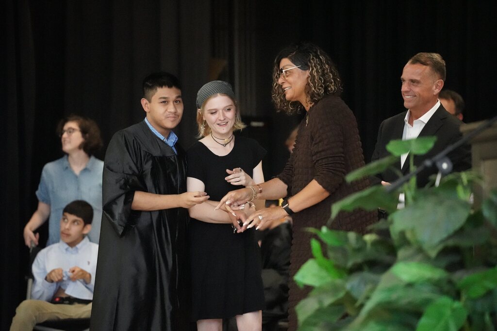 Graduate shaking hands with board member
